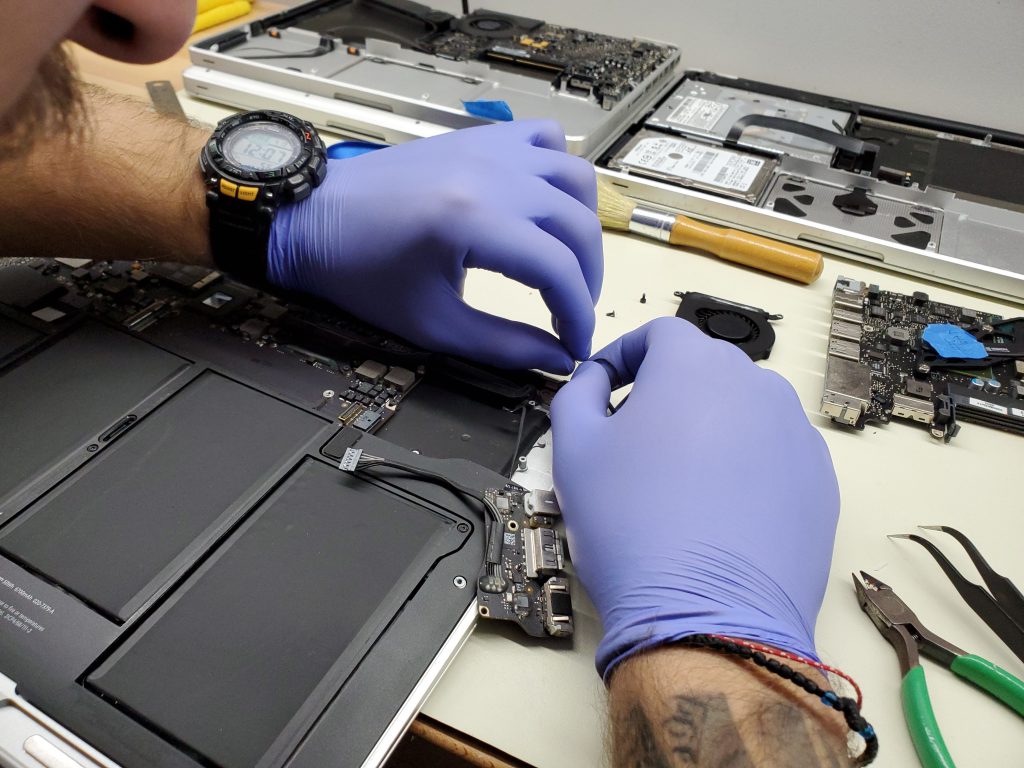 Technician Repairing Computer Laptop